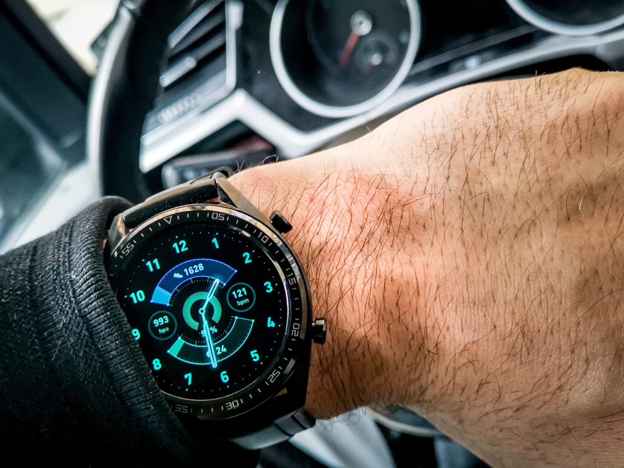 Smartwatch display showing fitness tracking interface with heart rate monitor and activity data on user's wrist