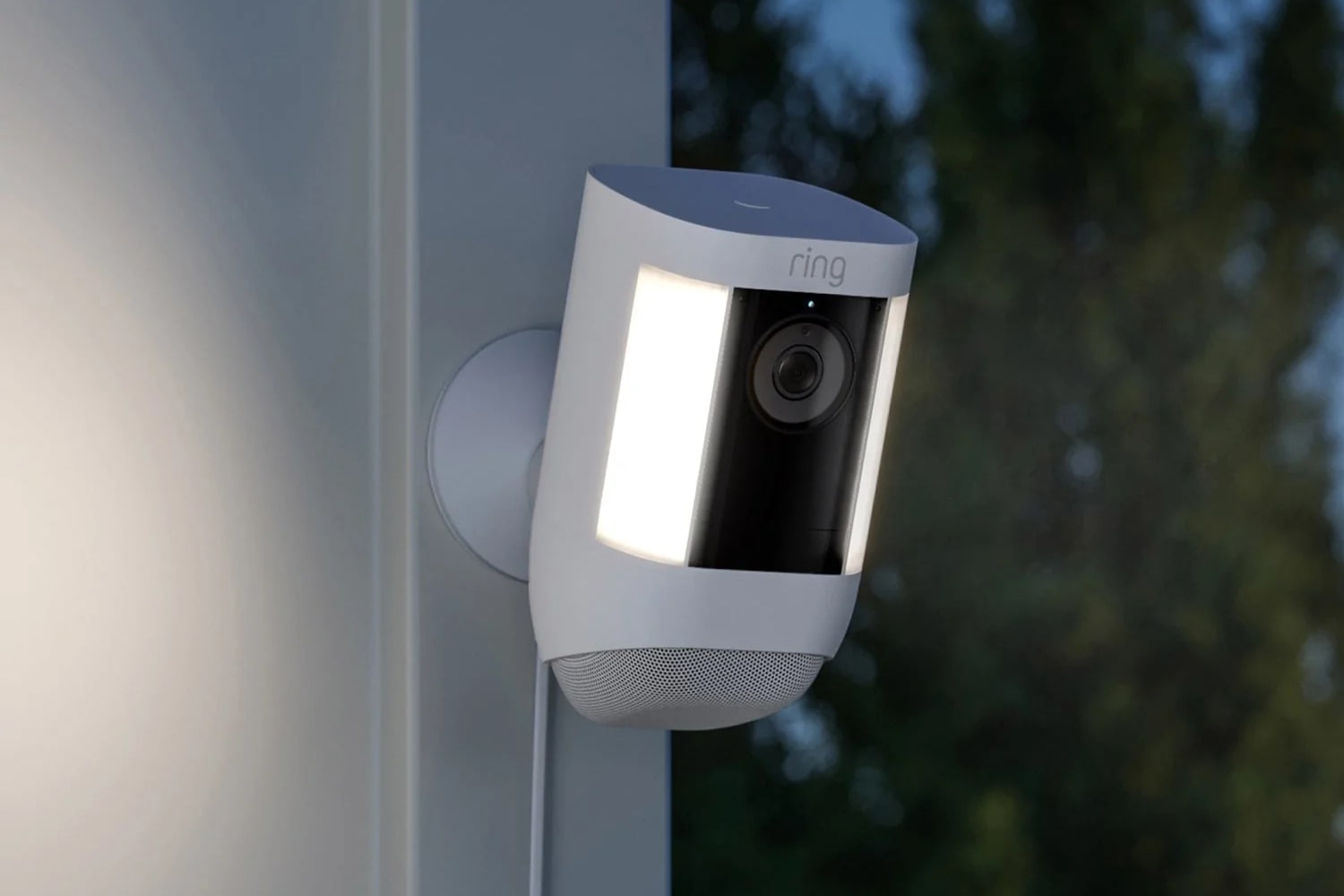 Ring Spotlight Cam Plus, a white outdoor security camera with an active spotlight, specialized in AI-powered package detection and theft alerts for home deliveries.
