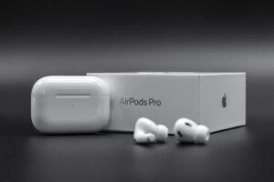 White Apple AirPods Pro 2 wireless earbuds with charging case next to their original retail box, for a comprehensive 2025 review.