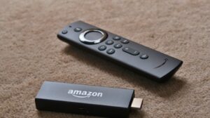 Amazon Fire TV Stick device and voice remote, symbolizing the best Fire TV Stick models for 2025, reviewed for top streaming performance.