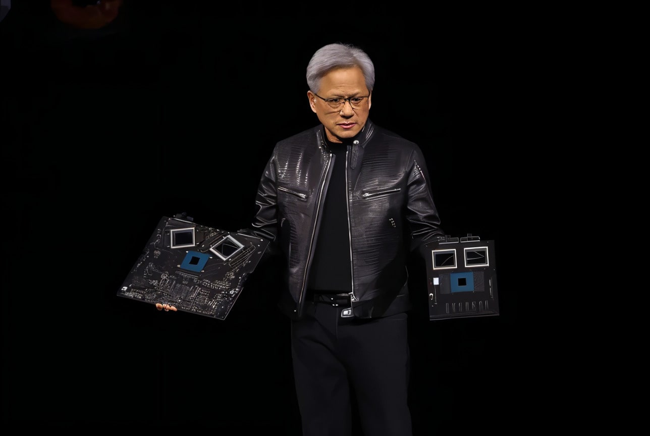 NVIDIA CEO presenting the NVIDIA Hopper H100 GPU at a tech event.